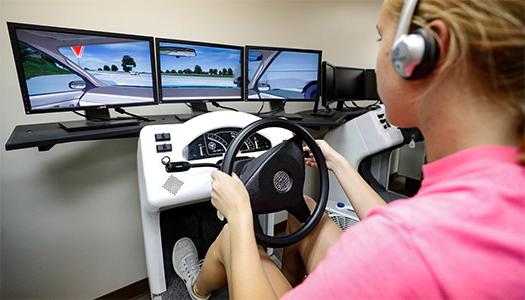 Student using the driving simulator at the Safety Center