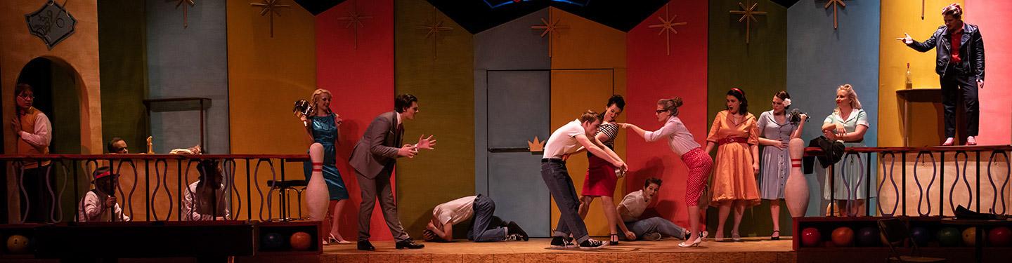 Students performing in a theatre show 5 Women