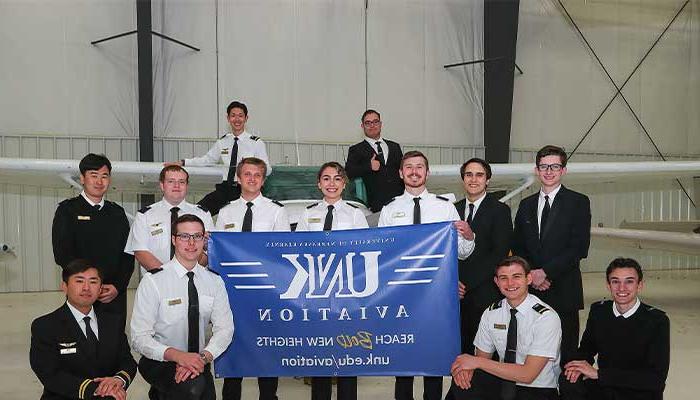 Group Picture in front of airplane